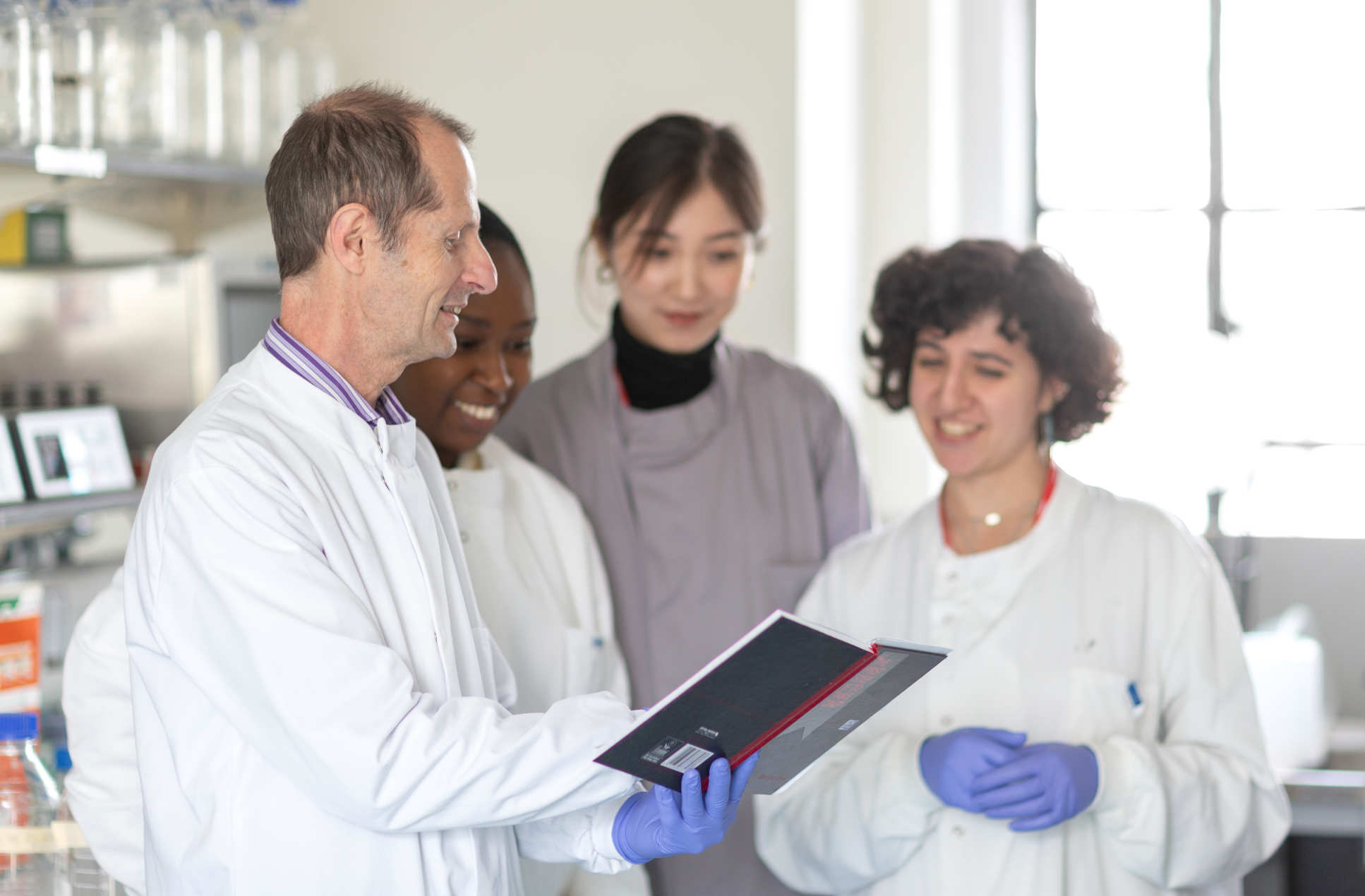 Professor Robin Shattock and team, working in the lab to develop a coronavirus vaccine.