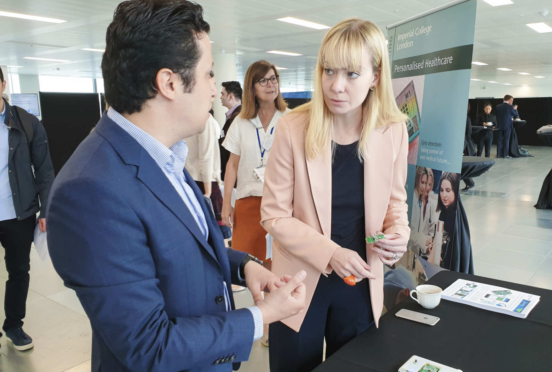 Dr Pantelis Georgiou and Baroness Blackwood discussing Lacewing, the newest iteration of rapid diagnostic microchip technology developed by Dr Georgiou's team  
