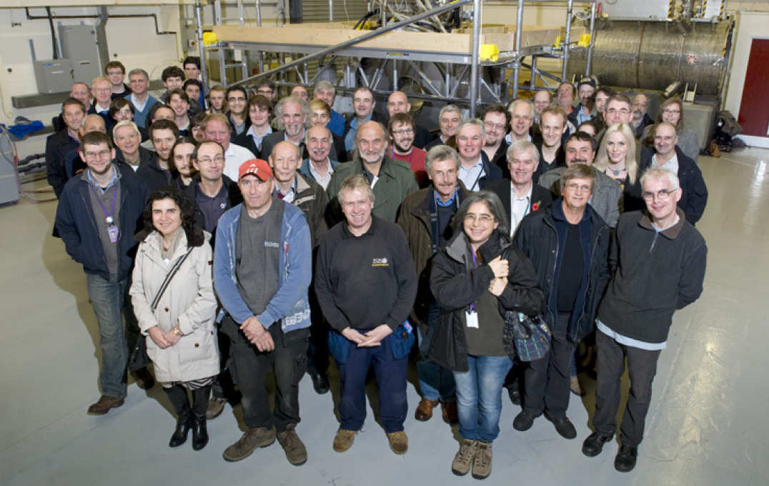 Large group of people in an industrial lab