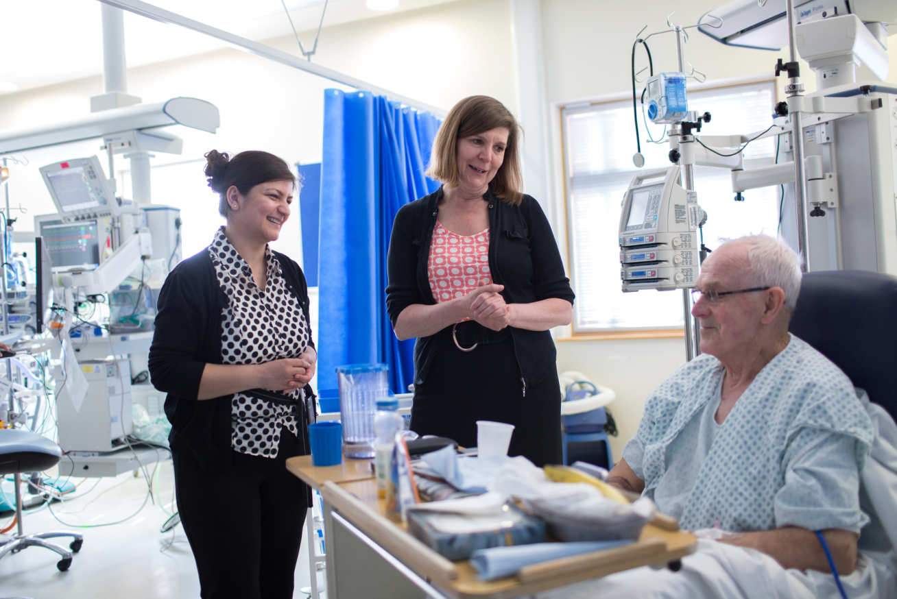 Professor Alison Holmes, Professor of Infectious Diseases, and Associate Medical Director at Imperial College Healthcare NHS Trust with a patient at Hammersmith Hospital