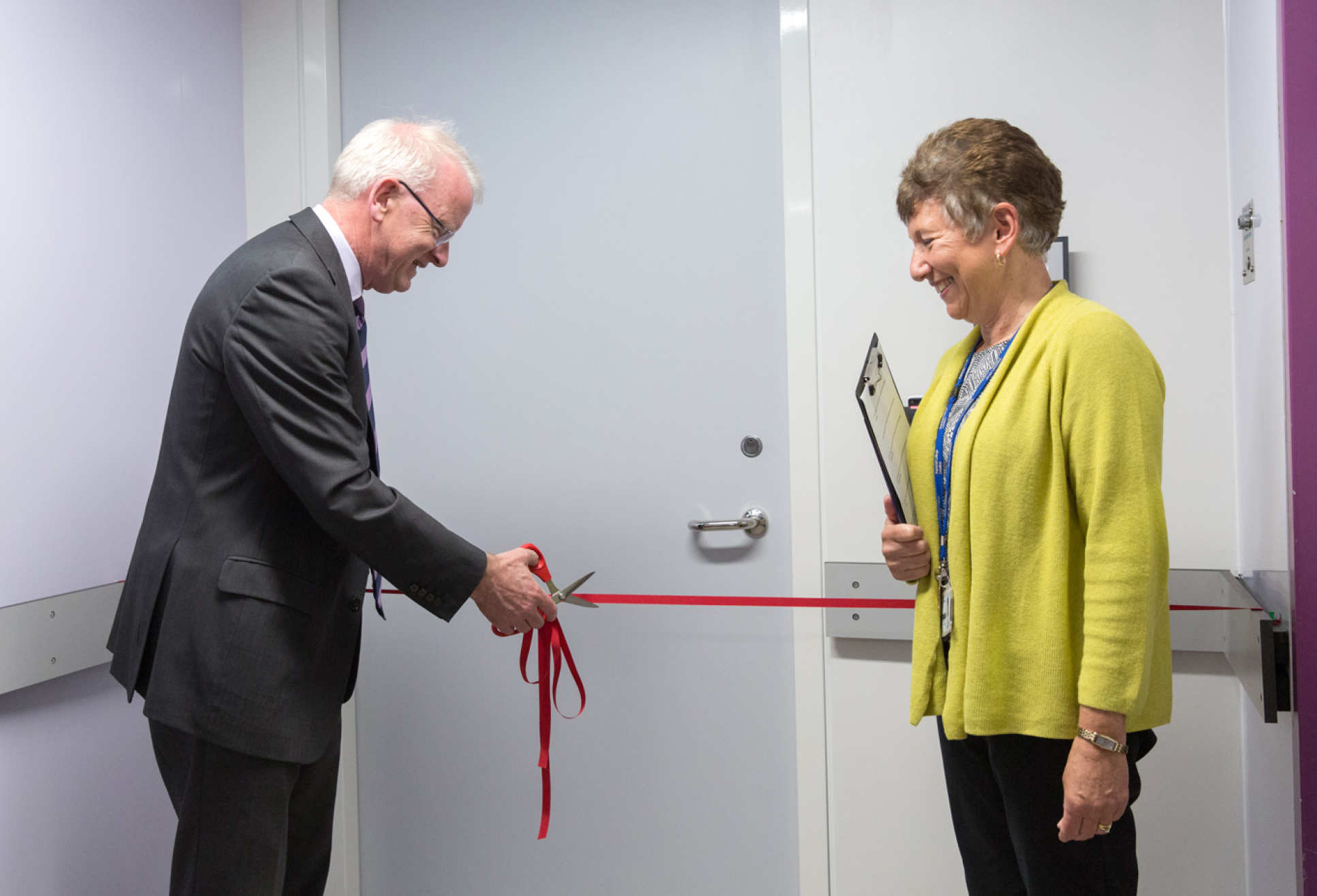 Provost Professor James Stirling cutting the ribbon at the new animal research facility