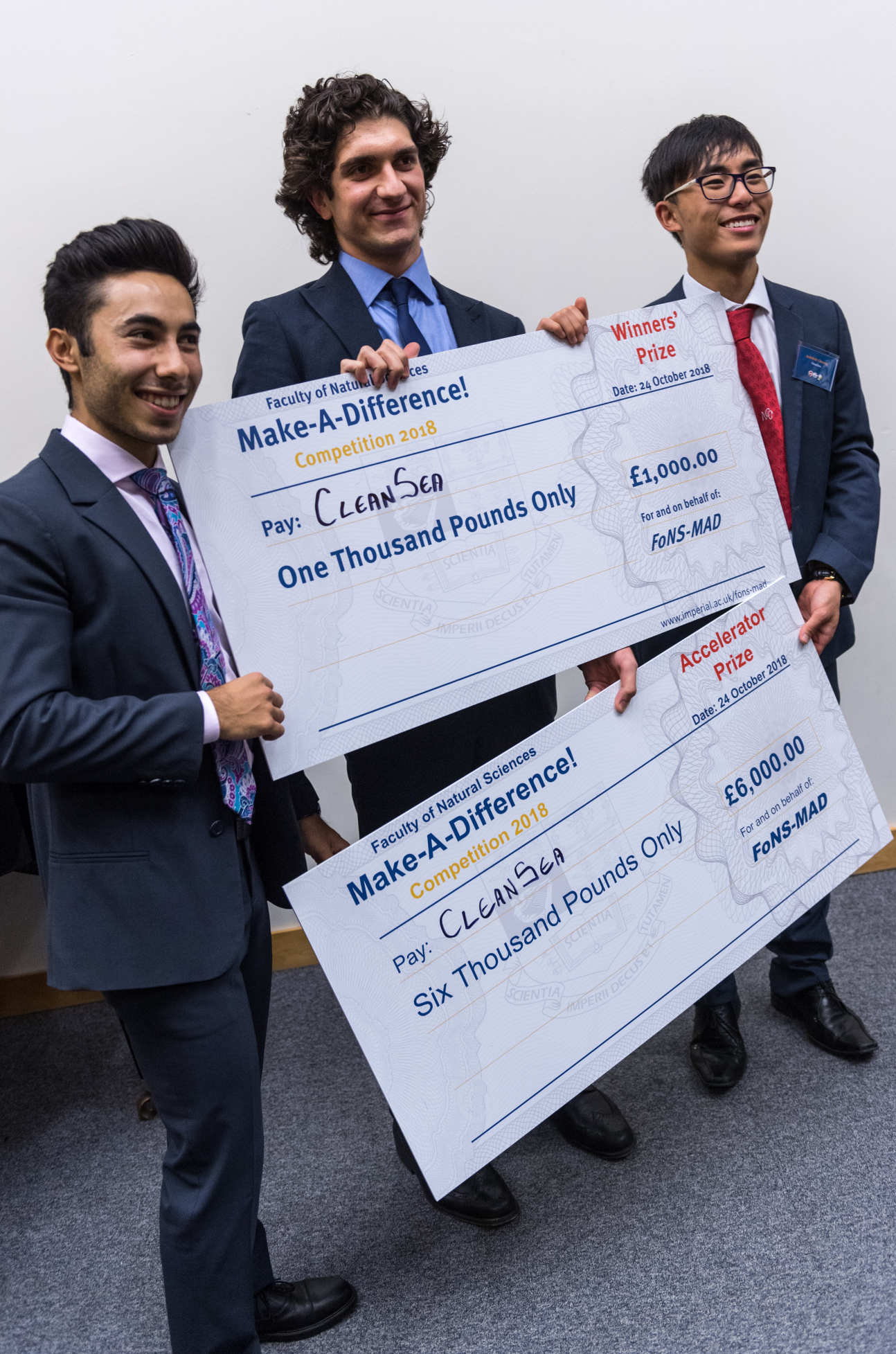 CleanSea with two giant cheques 