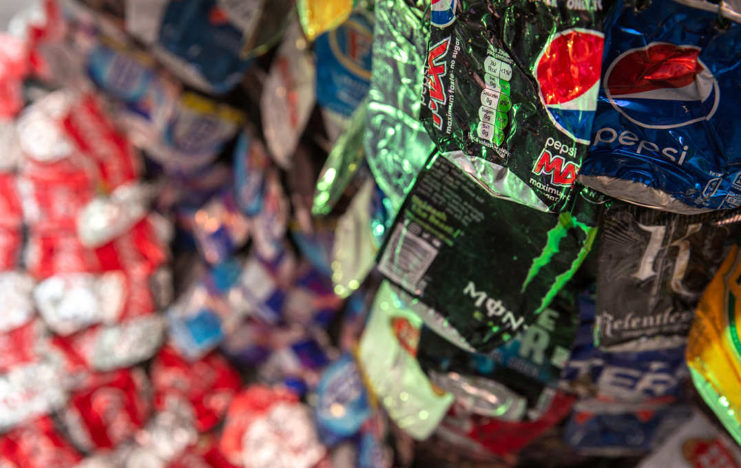 Close up of the flattened cans, reading Monster, Pepsi, Pepsi Max