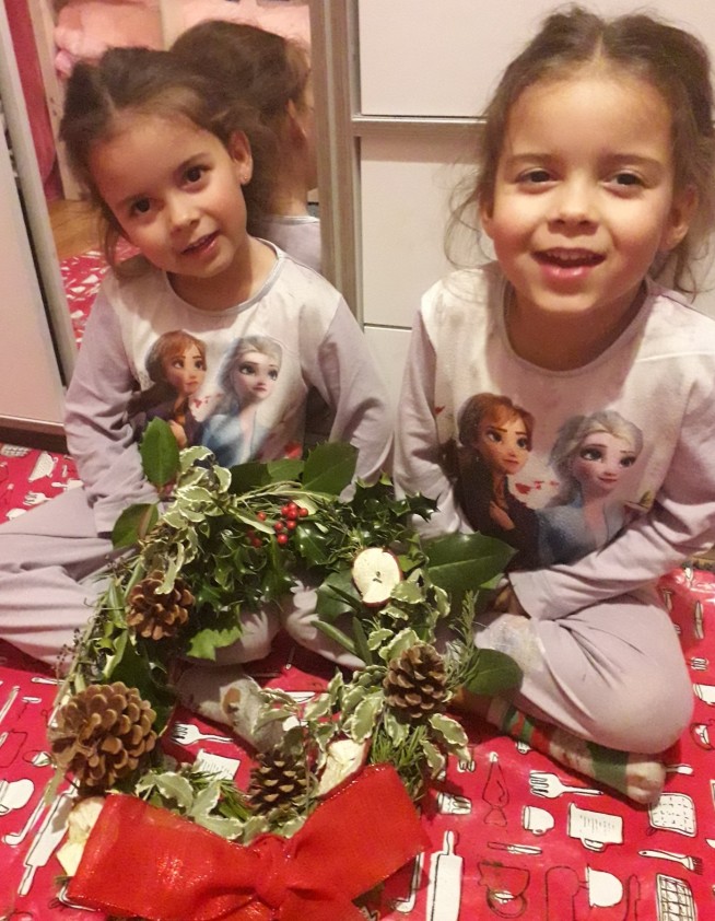 Young girls with their completed wreaths