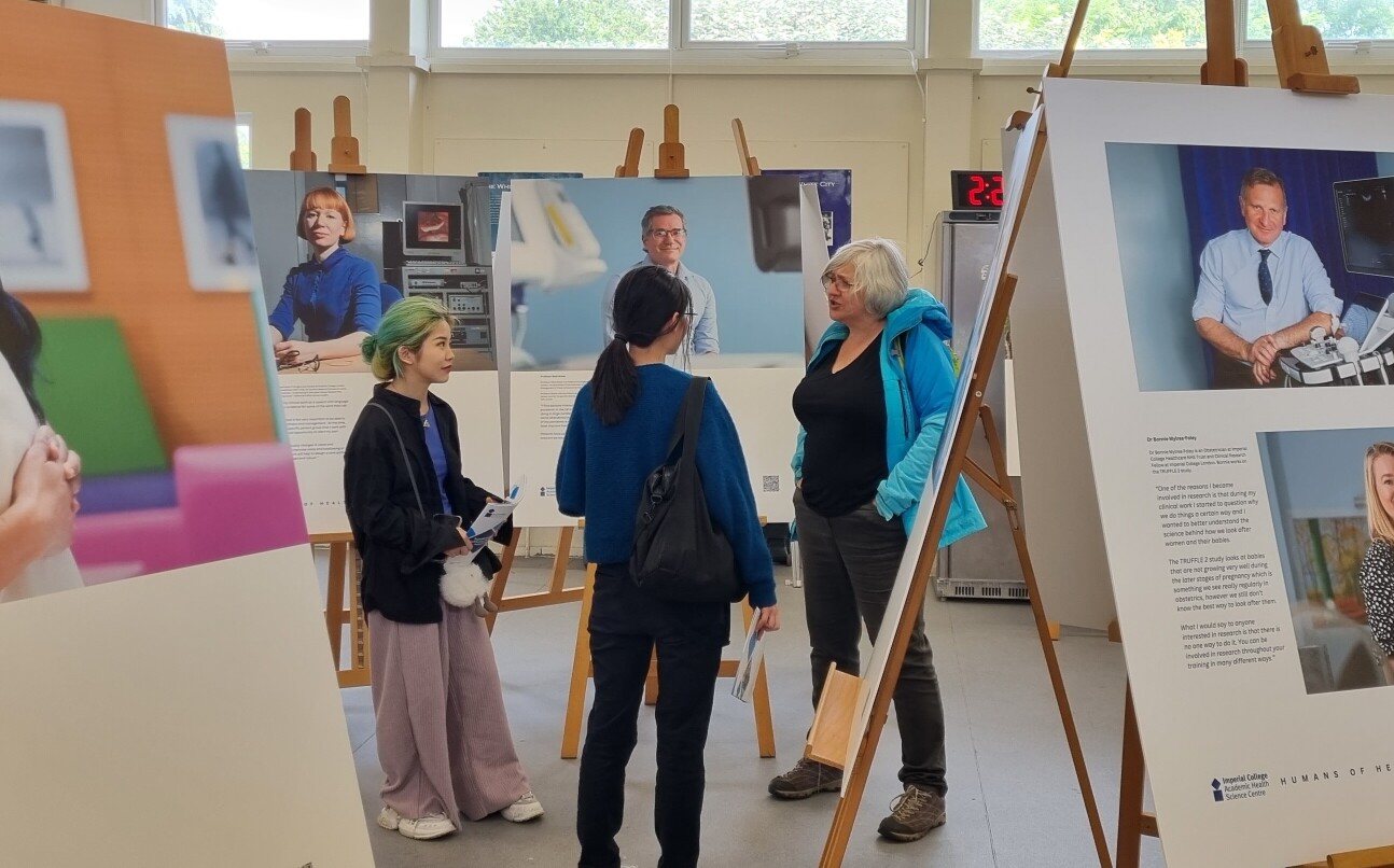 Visitors talking at the exhibition