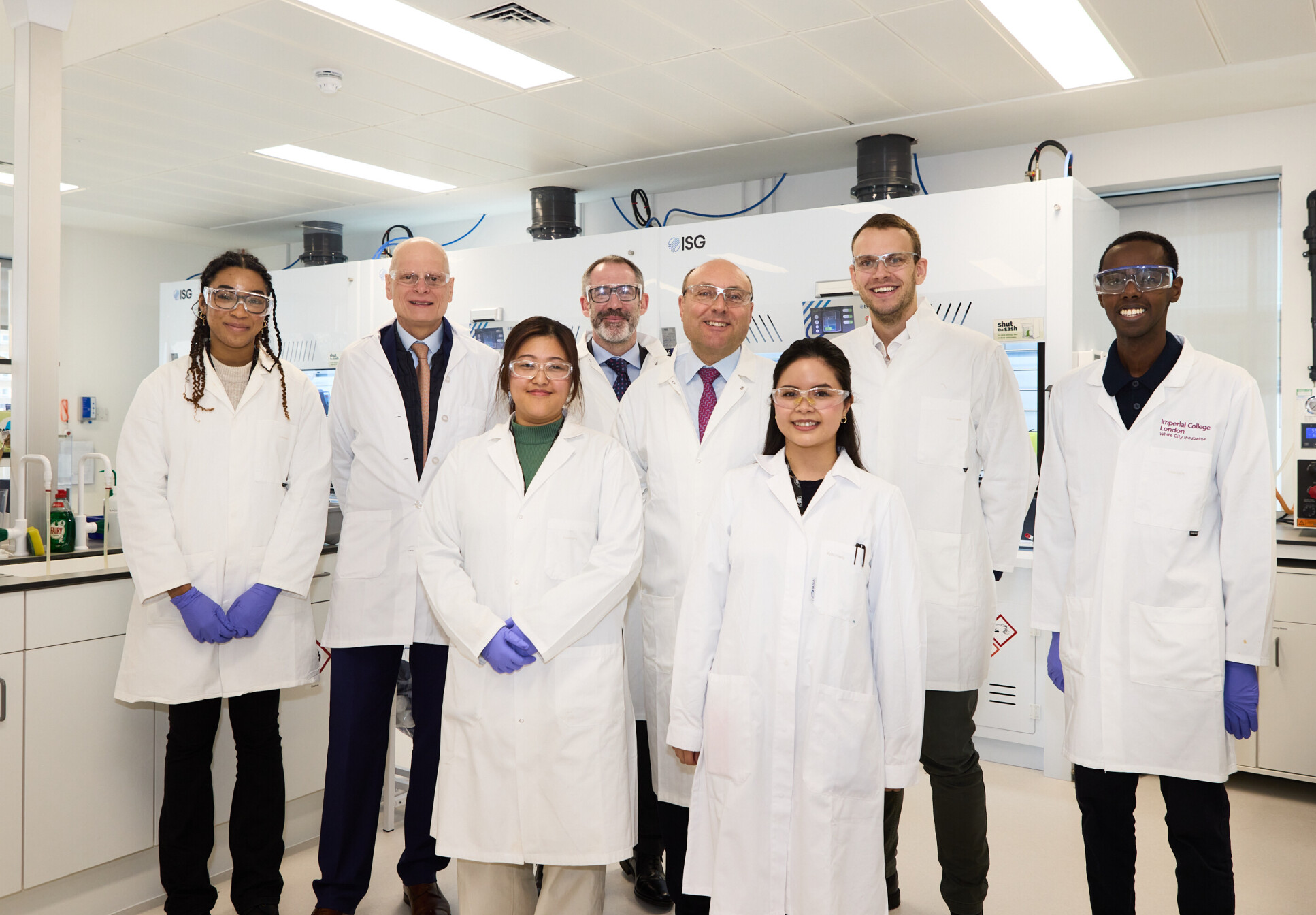 Minister Andrew Griffith MP, Professor Ian Walmsley and Professor Peter Haynes pictured smiling with the Puraffinity team in their research facilities