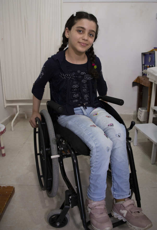 Photo of young girl in wheelchair