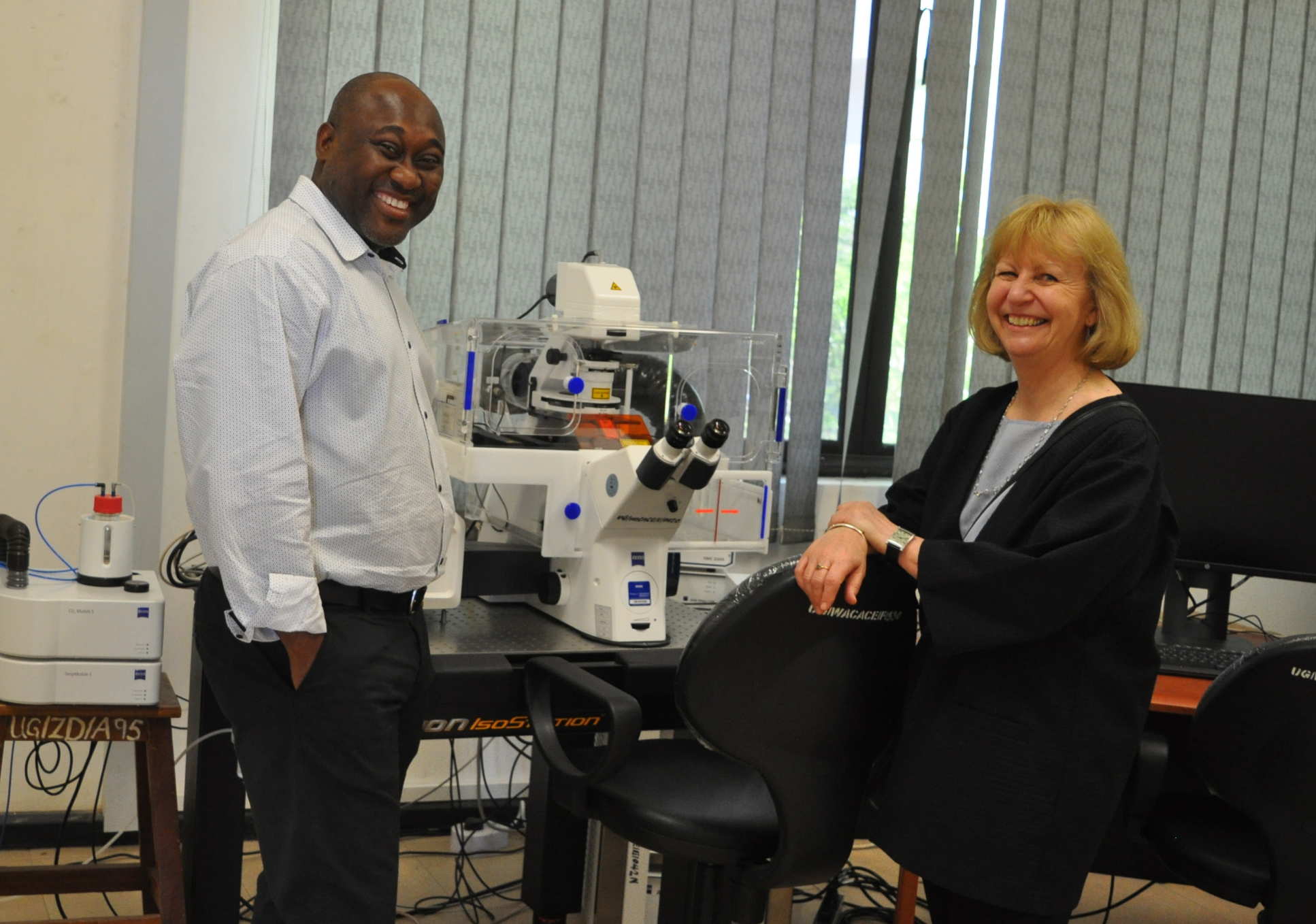 Professor Dallman discussed lab equipment with the Director of the West African Centre for Cell Biology of Infectious Pathogens at the University of Ghana