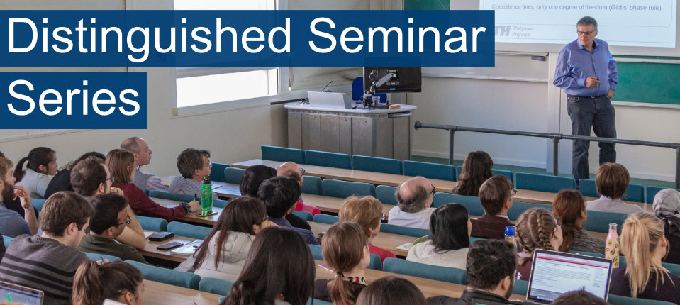 Man lecturing at the front of a lecture theatre