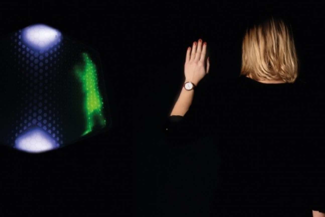 A woman demonstrates sensor technology