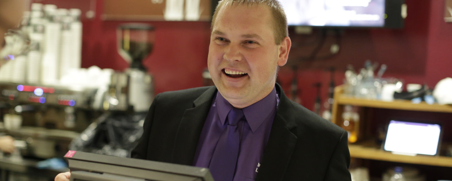 Campus Services staff member taking a customer order in the SCR Cafe