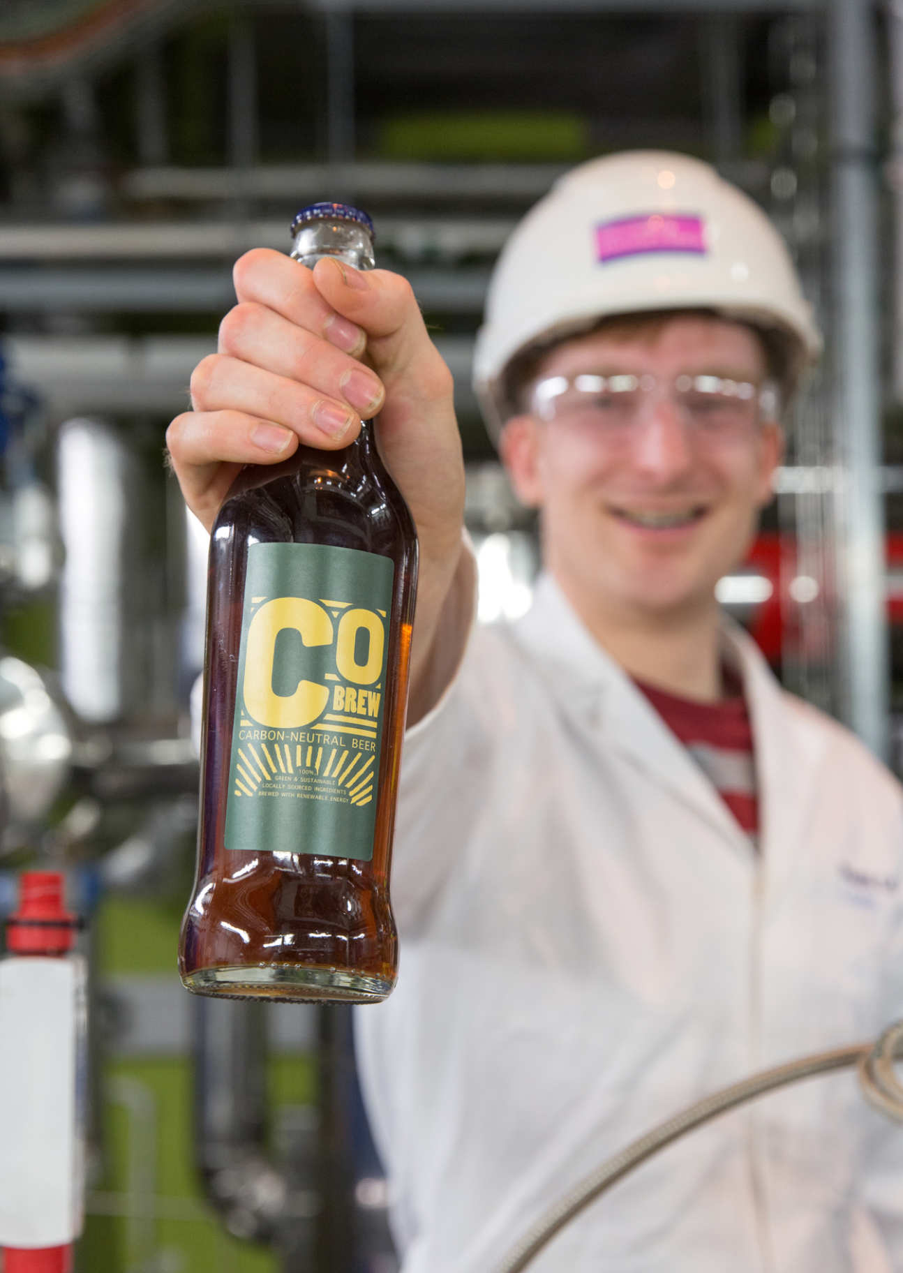 A bottle of CObrew beer held by Matt Barker
