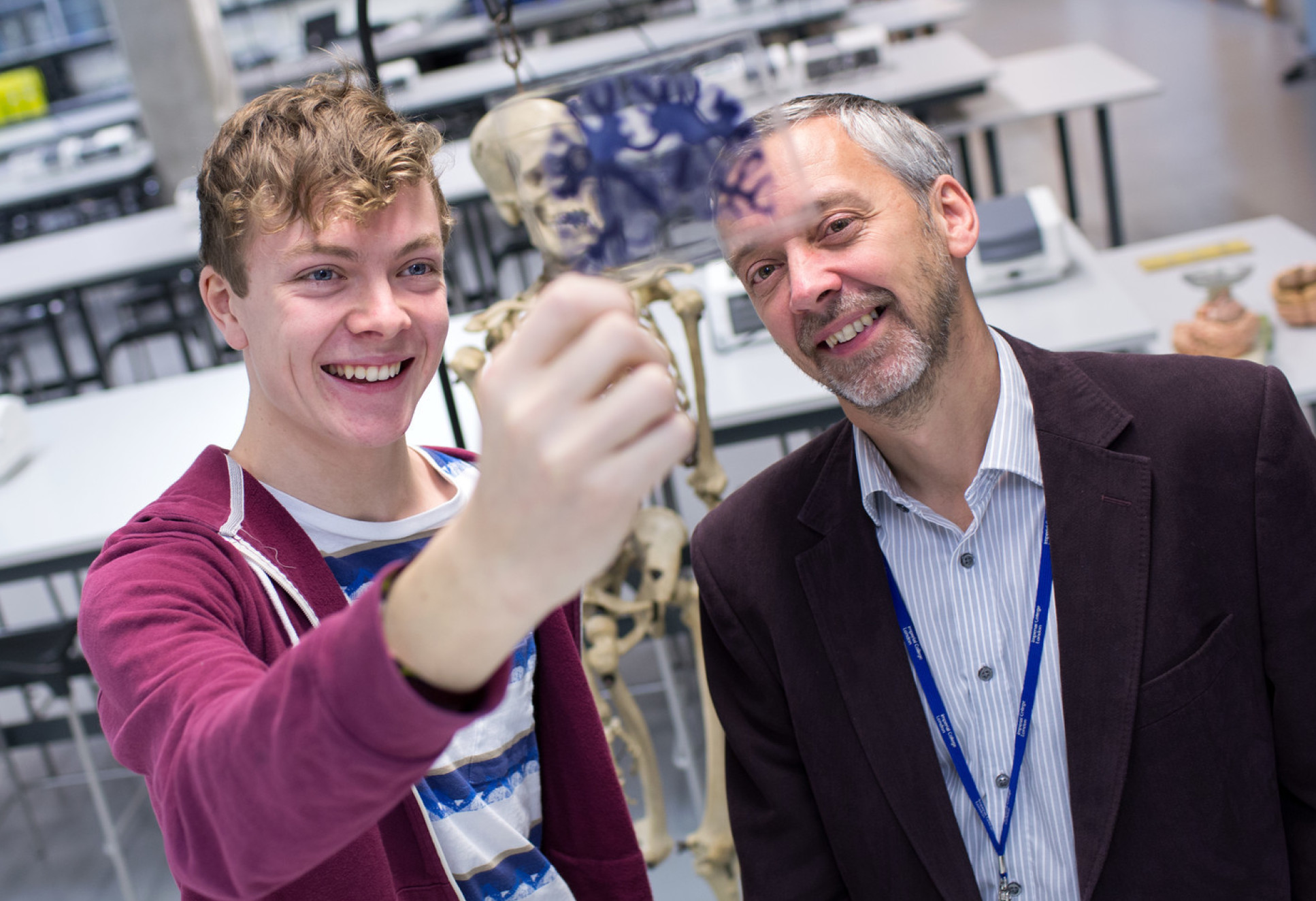 Professor Stephen Gentleman with Rector's Scholar William Fowkes looking at microscope slides of a brain