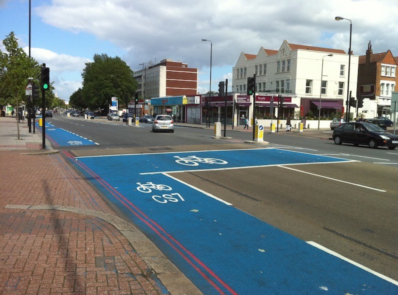 Cycle lane in blue along a main road