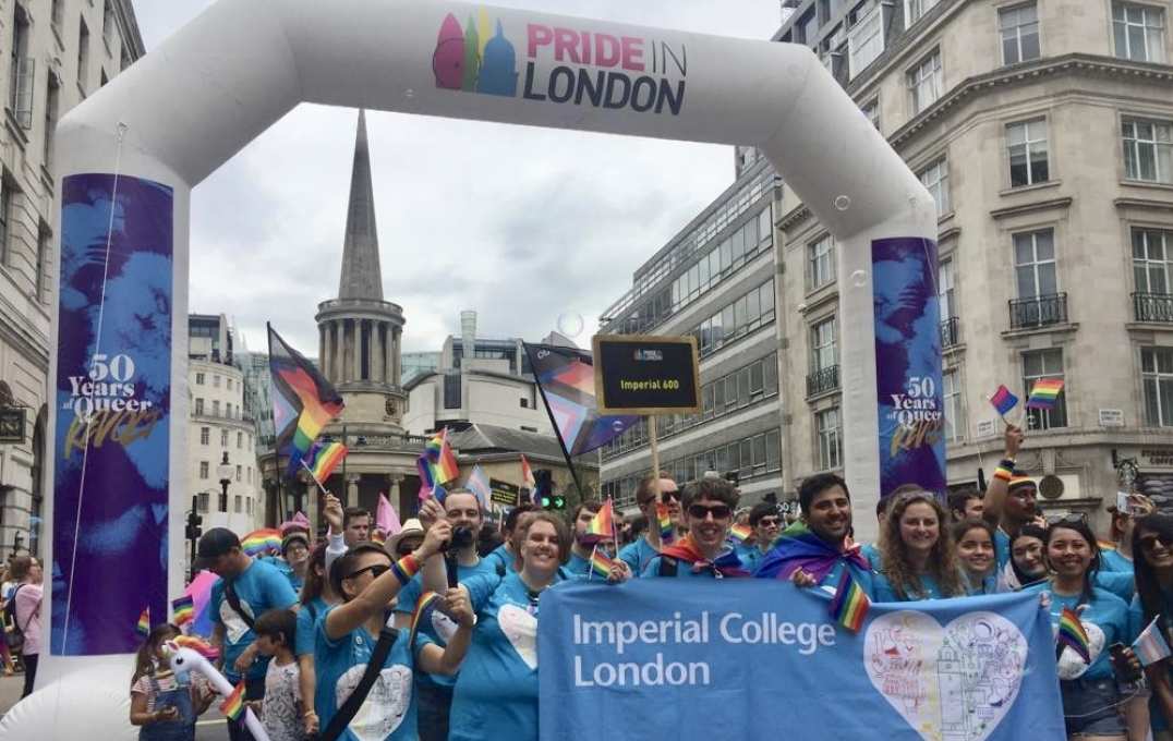group shot under pride in london logo