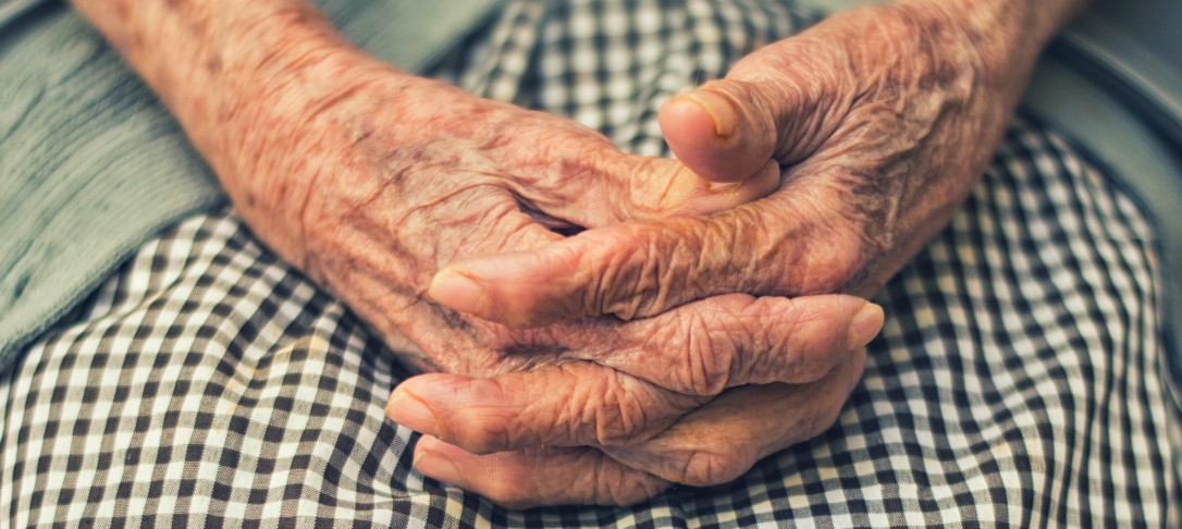 wrinkled hands of elderly woman