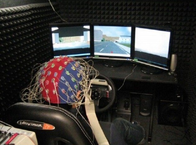 Someone in a driving simulation