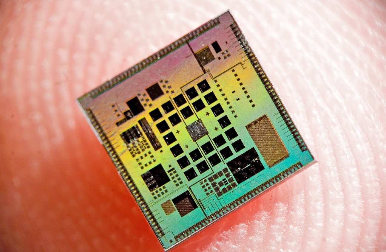 computer chip on a finger
