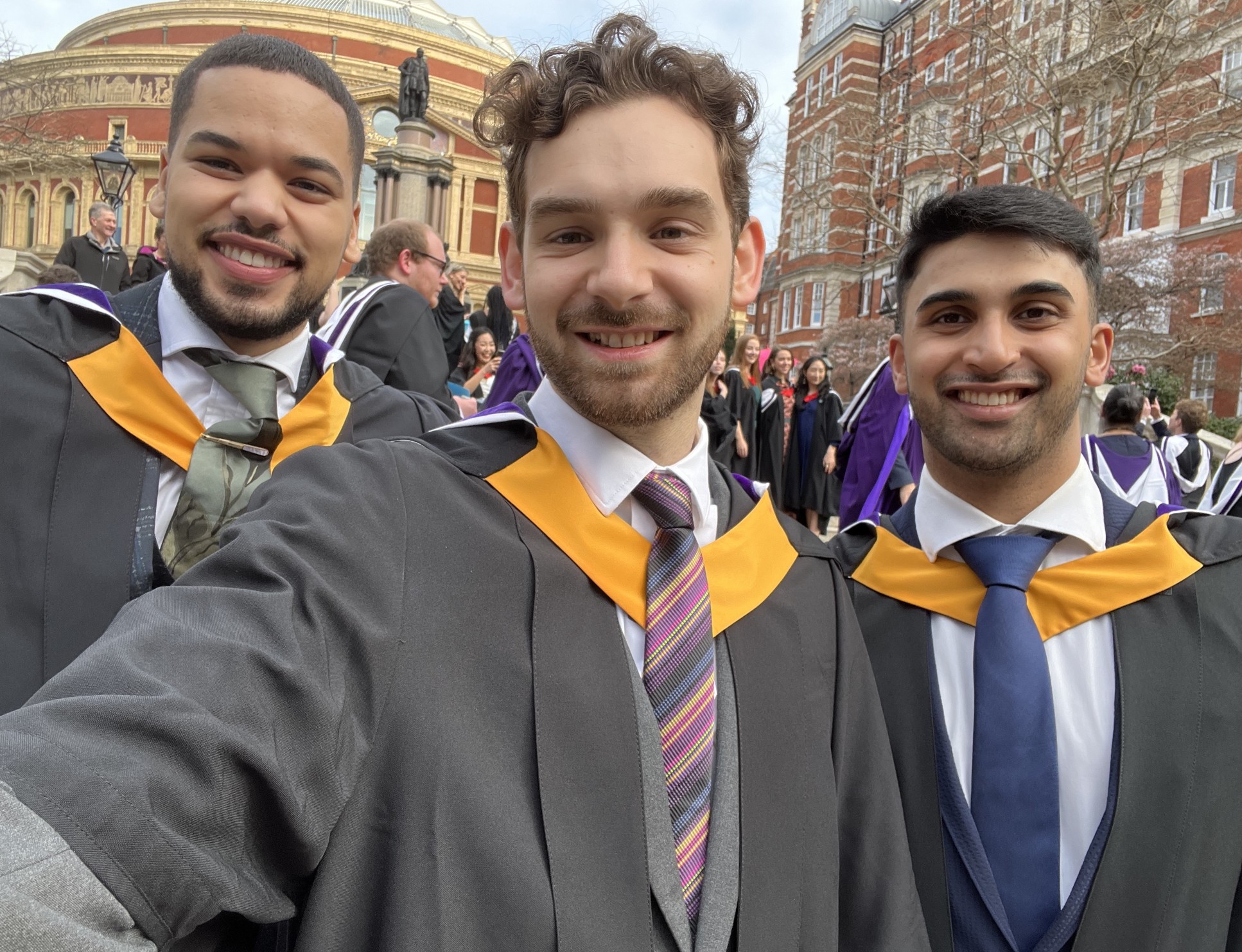 three male graduands