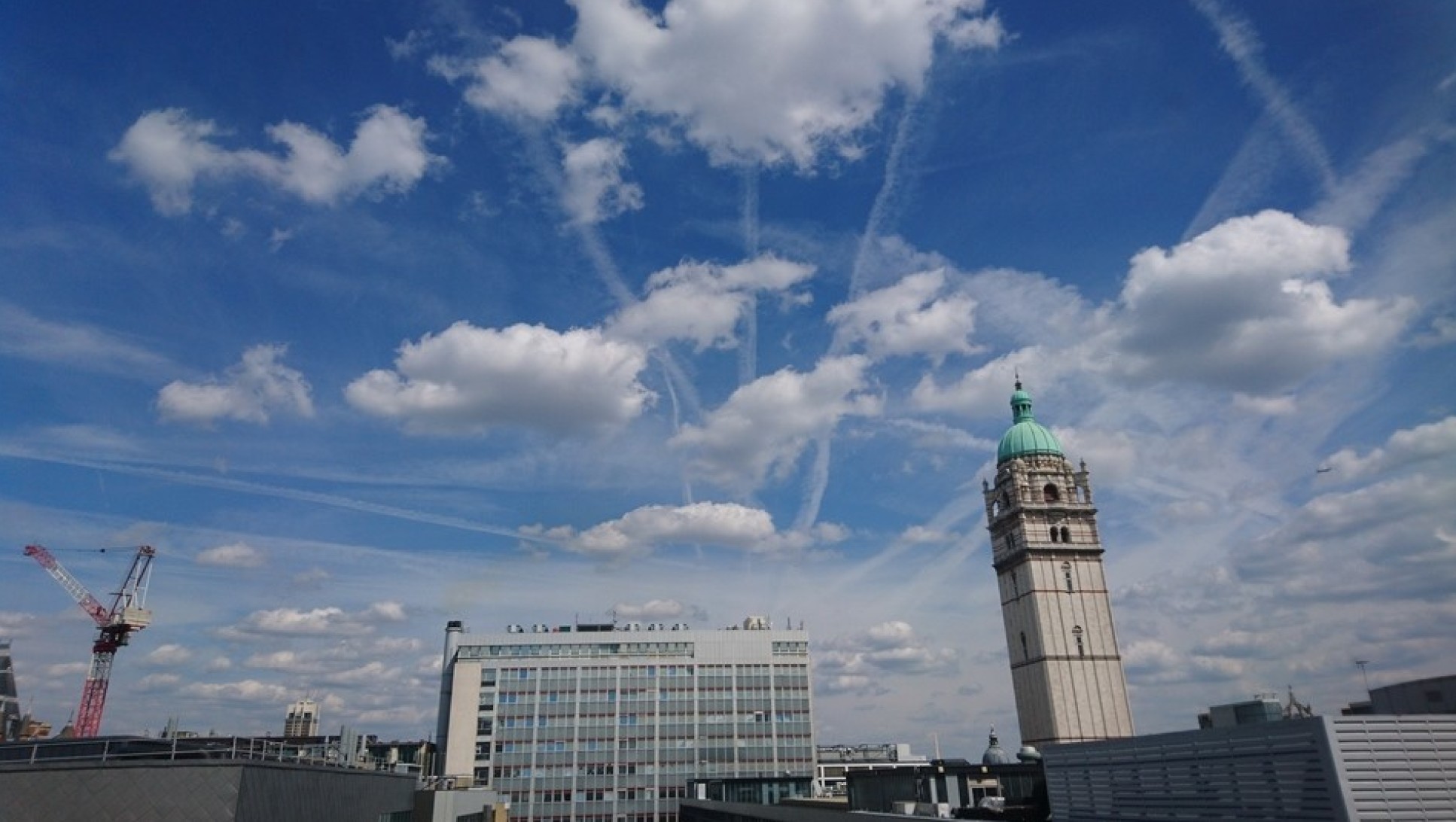 Contrails in the sky above Imperial College London