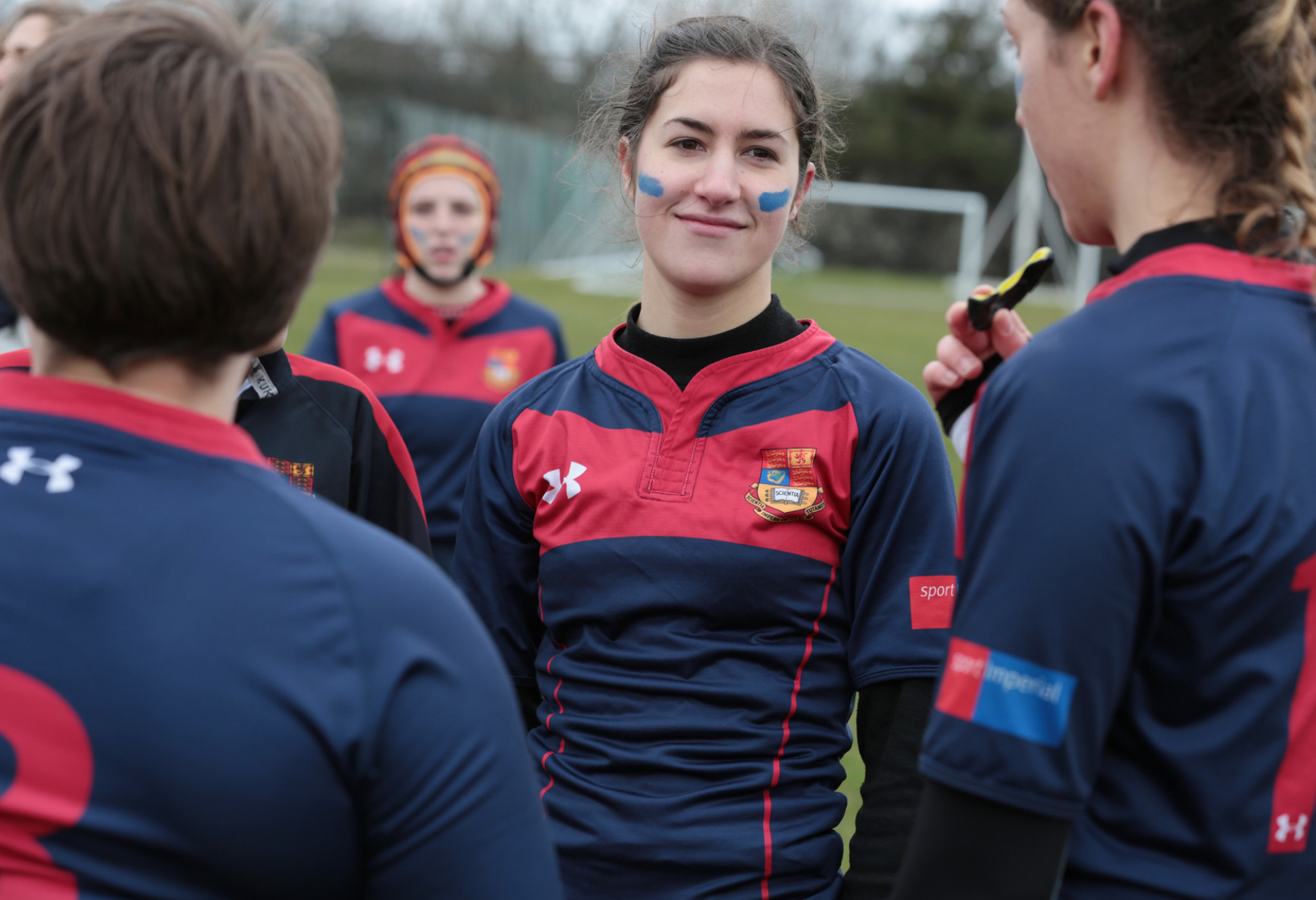 Women in sports kit play on field