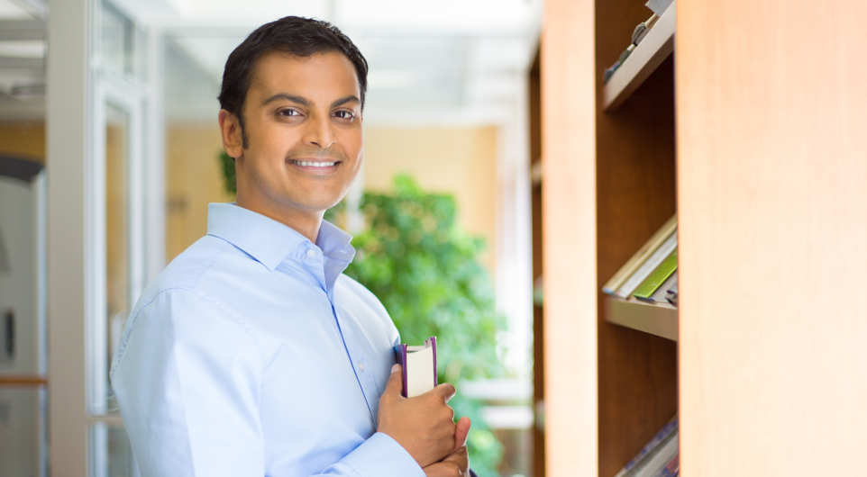 Man perusing book shelves