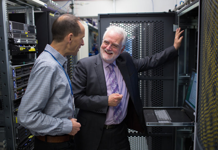 Institute for Security Science and Technology Director Professor Chris Hankin speaks with Institute Manager Andrew Burton at a computer terminal