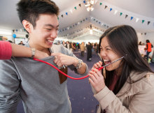 Visitors try out a stethoscope