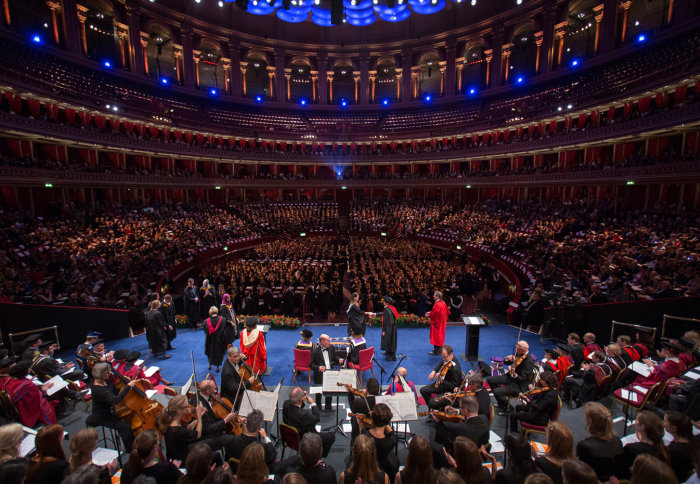 View of the Royal Albert Hall from the back of the stage with graduates being honoured