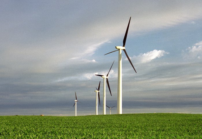 Five wind turbines in a field