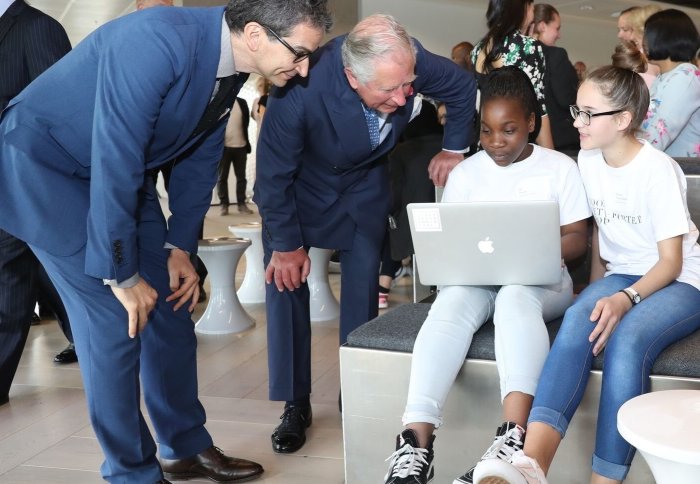 HRH The Prince of Wales and YOOX NET-A-PORTER GROUP CEO Federico Marchetti talks to West London schoolgirls learning to code at the company's Tech Hub in London