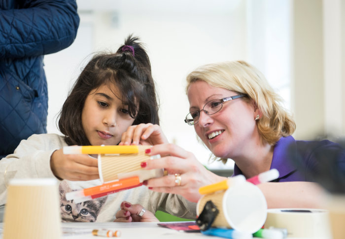 Annalisa with a child in the makerspace