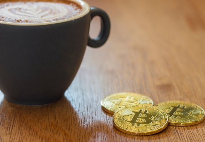 Cup of coffee with bitcoin