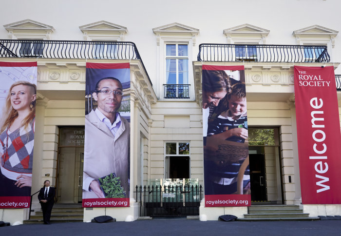 Front of the Royal Society building with large red welcome banners