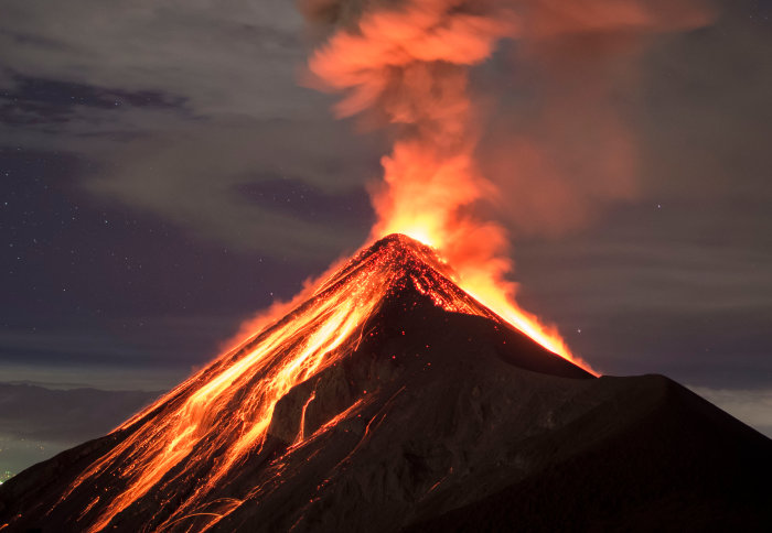 A volcano erupting lava