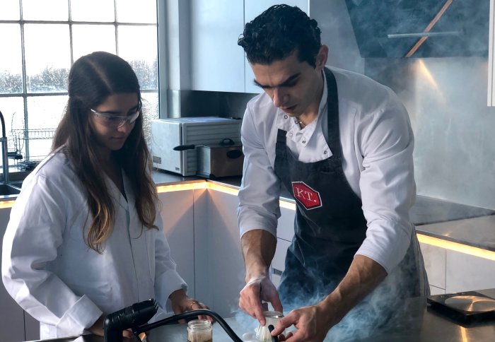 Jozef Youssef and Katerina Stavra cook in a kitchen