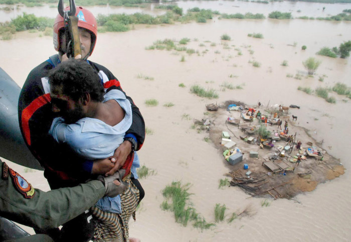 Main being airlifted from a flooded field