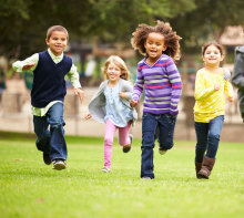 A group of school children running