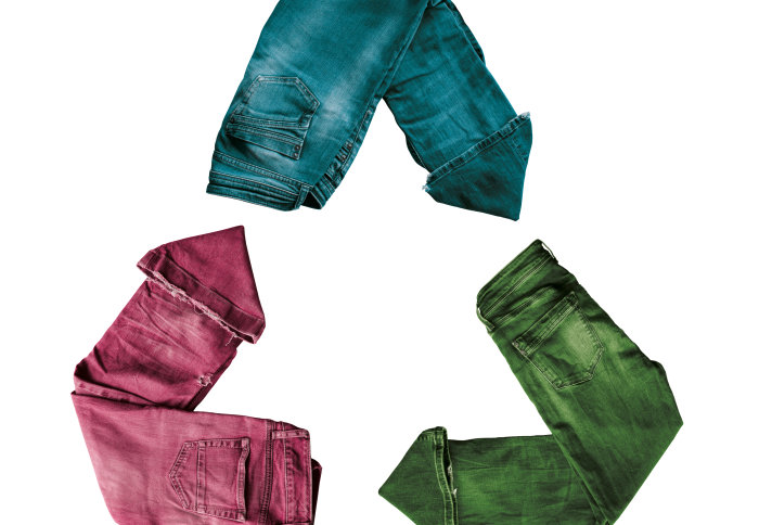 Trousers arranged in the shape of a recycled symbol