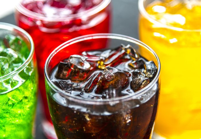 Several glasses of soft drinks with ice