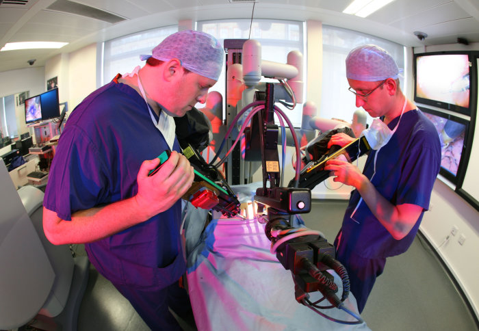 Surgeons using a robotic device