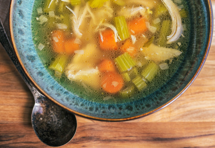Bowl of chicken soup broth