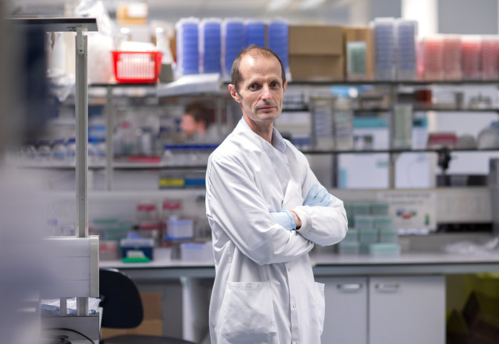 Professor Robin Shattock, from the Department of Infectious Disease, standing in his laboratory
