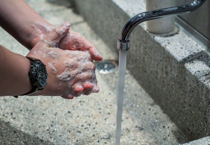 Person washing their hands