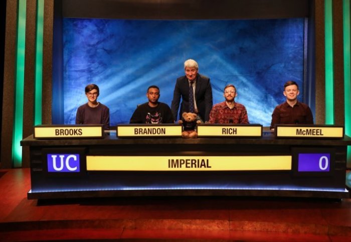 Students on University Challenge table with Jeremy Paxman