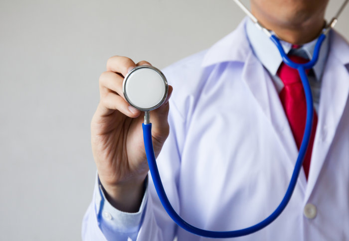 Generic image of a 'doctor' holding up a stethoscope