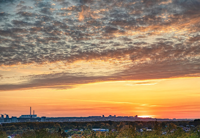 Orange sunrise over a city and landscape (Dmitry Karyshev CC-BY-2.0)