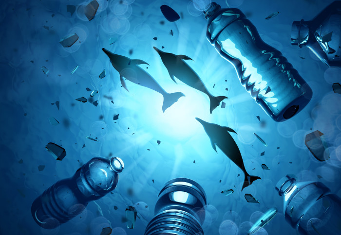 Dolphins swimming in an ocean filled with microplastics and plastic waste. Ocean water pollution concept. 3D illustration.