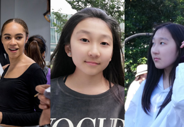 Three young girls smile at camera