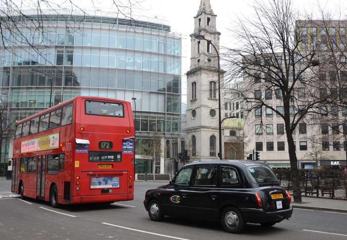 A black cab and red bus in London